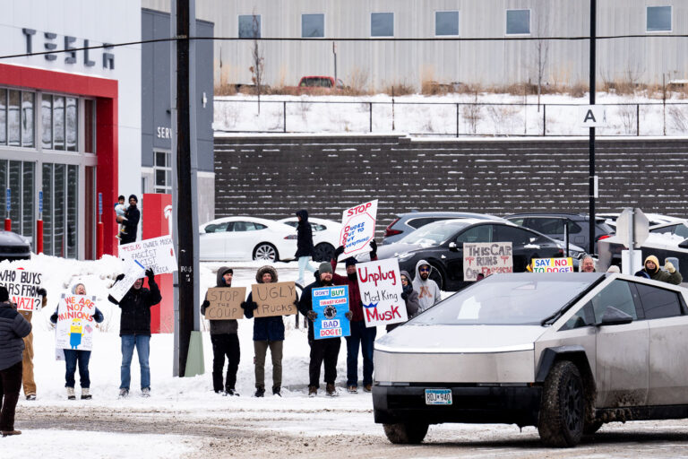 Tesla Takedown Protest at Golden Valley Service Center, Feb 15 2025 1 Protesters gathered at the Tesla Service Center in Golden Valley, Minnesota, on February 15, 2025, as part of a nationwide "Tesla Takedown" protest. This event, reportedly originating on Bluesky, aimed to critique Tesla and its owner, Elon Musk, with participants displaying signs that read "Unplug Mad King Musk," "This car runs on fascism," and "Say no to doge." The protest highlights public opposition to the company's practices and its leadership's influence. The Golden Valley service center, located just outside Minneapolis, serves as a key point for Tesla vehicle maintenance and sales in the region.