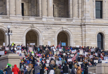 Protesters gathered at the Minnesota State Capitol on February 5, 2025 to protest actions taken by President Trump and Elon Musk. The protest was part of a nationwide protest said to be held in all 50 states.