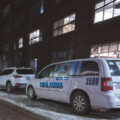 A taxi cab seen in the North Loop Minneapolis in February 2025. Windows covered in pictures of President Trump.