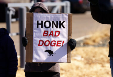 Protester at a Tesla facility just outside of Minneapolis(Golden Valley). Protesters have been gathering each Saturday for weeks.