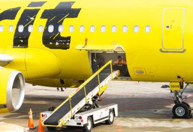 A baggage handler inside a Spirit Airlines plane at Minneapolis St. Paul Airport.