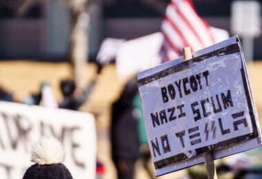 Protest sign reading:

"Boycott Nazi Scum No Tesla".

Protesters have gathered each Saturday for weeks now at this Tesla Facility just outside of Minneapolis (Golden Valley).