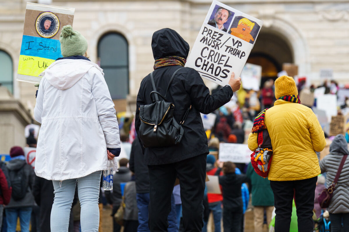 Protesters at the Minnesota State Capitol in St. Paul, Minnesota on March 4, 2025.  Taking place on the afternoon of President Trump’s first address to joint session in congress, they are protesting the actions of the Trump Administration and Elon Musk’s involvement. The protest was organized along with others around the nation part of the “50501 protests”. This is the first of two planned protests. Another is planned for Saturday at the State Capitol.

Protest sign reading “Cruel Chaos”.