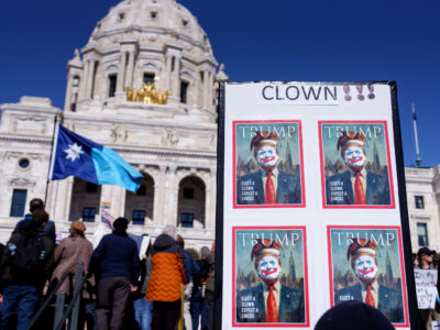 Elect a Cown Expect a Circus protest sign