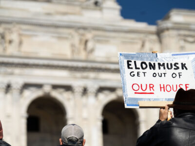 Elon Musk Get Out Of Our House Protest Sign