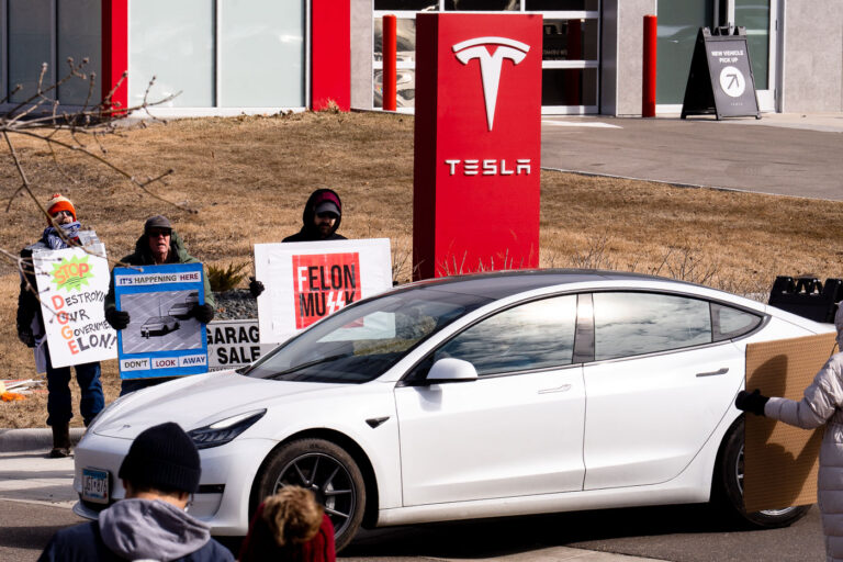 Tesla Takedown Protest Minneapolis March 22, 2025 1 Tesla Takedown protest at a Tesla showroom in Minneapolis (Golden Valley) on March 22, 2025. This is the 6th week in a row protesters have gathered. The crowd has continued to grow exponentially each week.