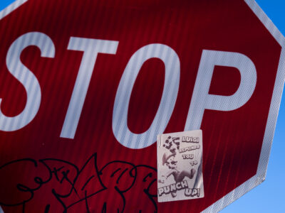 Luigi Mangione Radical Sticker on Stop Sign, South Minneapolis