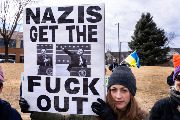 Tesla Takedown Protest Minneapolis March 22, 2025 2 Tesla Takedown protest at a Tesla showroom in Minneapolis (Golden Valley) on March 22, 2025. This is the 6th week in a row protesters have gathered. The crowd has continued to grow exponentially each week.