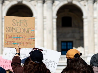 She's Someone Protest Sign Minnesota March 8 2025