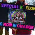 Protester holding a sign that reads "Special K Elon Is Now In Charge" at a Tesla Facility just outside of Minneapolis (Golden Valley) on March 8, 2025.

This is the 4th week in a row protesters have gathered here as part of the nationwide Tesla Takedown organizing.