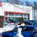 Protesters hold up signs outside a Tesla Facility just outside of Minneapolis (Golden Valley) on March 8, 2025.

This is the 4th week in a row protesters have gathered here as part of the nationwide Tesla Takedown organizing.