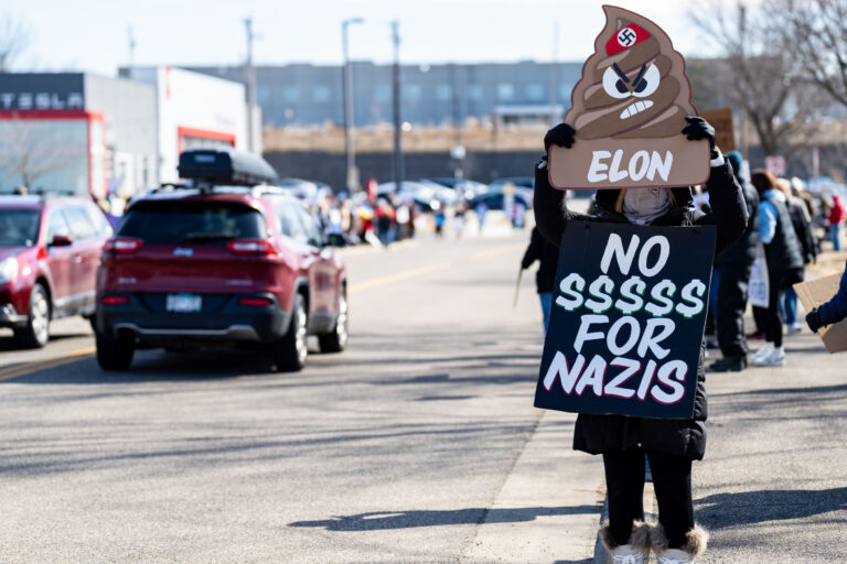 Tesla Takedown Protest Minneapolis March 22, 2025 4 Tesla Takedown protest at a Tesla showroom in Minneapolis (Golden Valley) on March 22, 2025. This is the 6th week in a row protesters have gathered. The crowd has continued to grow exponentially each week.