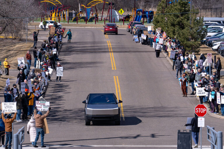 Tesla Takedown Protest Minneapolis March 22, 2025 4 Tesla Takedown protest at a Tesla showroom in Minneapolis (Golden Valley) on March 22, 2025. This is the 6th week in a row protesters have gathered. The crowd has continued to grow exponentially each week.