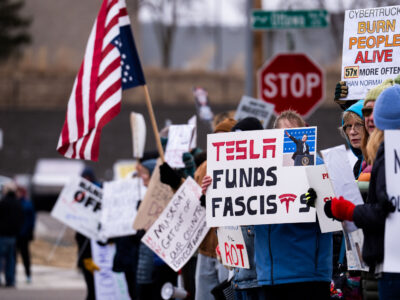 Tesla Funds Fascists protest sign in Golden Valley