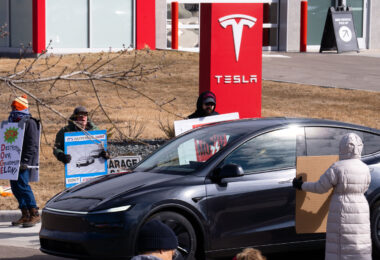 Tesla Takedown protest at a Tesla showroom in Minneapolis (Golden Valley) on March 22, 2025. This is the 6th week in a row protesters have gathered. The crowd has continued to grow exponentially each week.