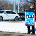 Protester holds a sign that reads "Dump Tesla Save America". Seen at a Tesla facility just outside of Minneapolis (Golden Valley) on March 8, 2025.

This is the 4th week in a row protesters have gathered here as part of the nationwide Tesla Takedown organizing.