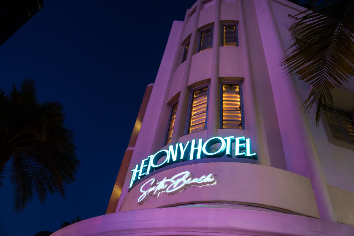 The Tony Hotel lit up signs at night in Miami Beach Florida