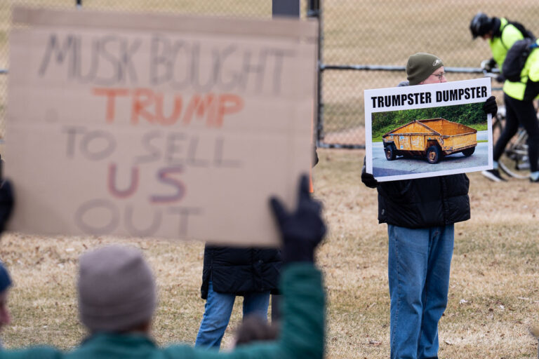 Trumpster Dumpster Tesla Protest sign in Minneapolis 4 About 500 protesters outside Tesla in Minneapolis (Golden Valley) with signs reading “NOT PAID JUST PISSED”, “Tesla Funds Fascists”, “Save the VA”, “No Vet Left Behind”, Make Nazis Afraid Again” to name a few. This is the 7th weekend in a row of protests at this showroom.