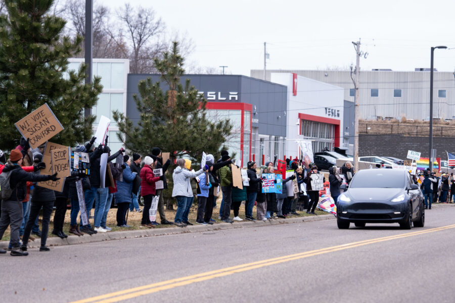Vote Susan Crawford protest sign at Tesla Golden Valley 2025
