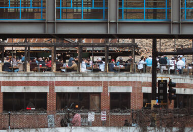 A full rooftop patio at Cowboy Jack's in downtown Minneapolis on a warm spring day.
