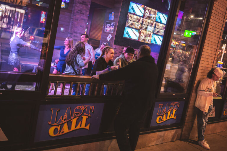 Last Call Bar in Downtown Minneapolis 4 Patrons dance inside Last Call bar on N 5th Street in downtown Minneapolis.