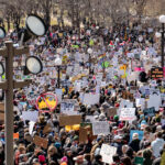 Protest signs at Hands Off St. Paul Minnesota 4 The Minnesota State Patrol estimates 25,000 gathered at the Minnesota State Capitol this afternoon as part of the nationwide “Hands Off!” protests.