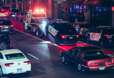 A Minneapolis Police squad car is towed off Lagoon Ave in Uptown Minneapolis in April 2025.