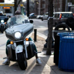 Motorcycles hit the sidewalk to go to McDonalds.