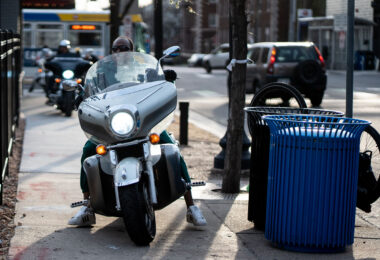 Motorcycles hit the sidewalk to go to McDonalds.
