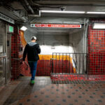 Park Street Station Red Line Passage 3 Inside Park Street station, one of the oldest active subway stations in the United States. Opened in 1897 as part of the Tremont Street Subway, the station has long served as a central transfer point beneath Boston Common. The tiled corridors and low ceilings reflect early subway construction techniques, with later renovations layering modern lighting, signage, and safety systems onto the original structure. Directional signage for the Ashmont and Braintree branches marks this passage as part of the MBTA Red Line, which continues to use Park Street as a key junction between downtown Boston and the city’s southern neighborhoods.
