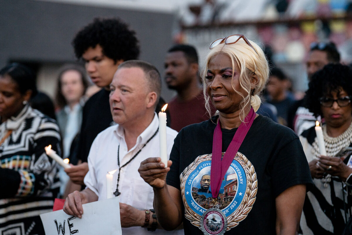 Angela Harrelson, George Floyd's aunt and co-chair of Rise and Remember, with a candle during a vigil on the 5th anniversary of George Floyd's murder.