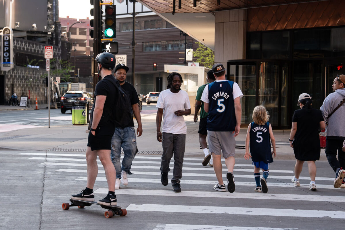 Fans in downtown Minneapolis heading to Target Center for a Minnesota Timberwolves playoff game.