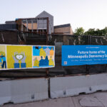 New fence wrap around the burned Minneapolis police station. The police station will eventually be the Minneapolis Democracy Center.