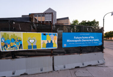 New fence wrap around the burned Minneapolis police station. The police station will eventually be the Minneapolis Democracy Center.