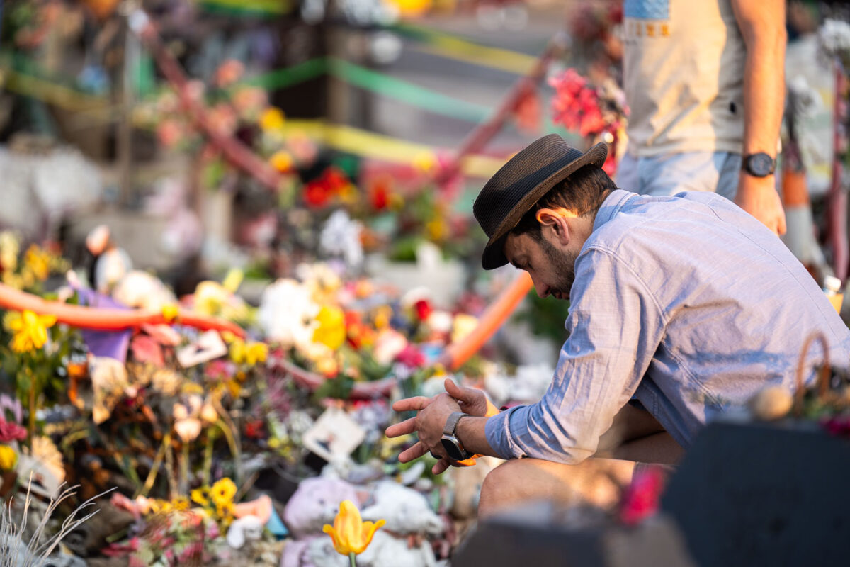 A man shows his respects at the George Floyd Memorial on the 5th anniversary of his murder.