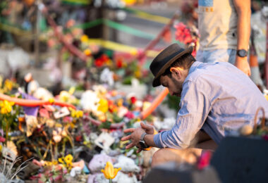 A man shows his respects at the George Floyd Memorial on the 5th anniversary of his murder.