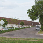 Concrete barriers setup in the grass on S 9th Street in Minneapolis by MNDOT. The barriers are to prevent camping.