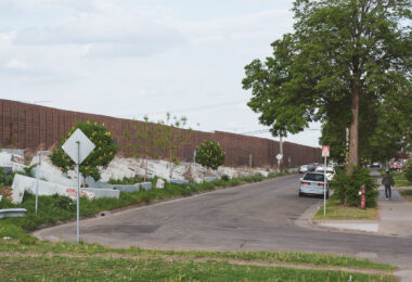 Concrete barriers setup in the grass on S 9th Street in Minneapolis by MNDOT. The barriers are to prevent camping.