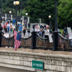 Flag hung from John Ireland Blvd in St Paul at No Kings 4 Despite warnings from the law enforcement not to attend today’s No Kings rally after this mornings shootings of Minnesota lawmakers with the killer on the lose, the No Kings Rally is happening at the Minnesota State Capitol in St. Paul.