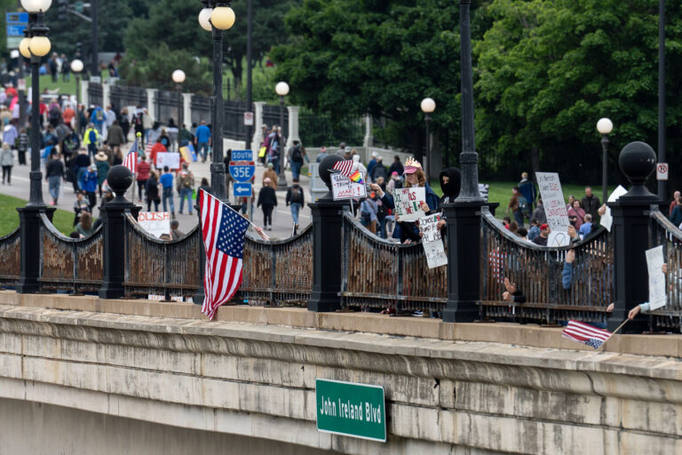 Flag hung from John Ireland Blvd in St Paul at No Kings 4 Despite warnings from the law enforcement not to attend today’s No Kings rally after this mornings shootings of Minnesota lawmakers with the killer on the lose, the No Kings Rally is happening at the Minnesota State Capitol in St. Paul.