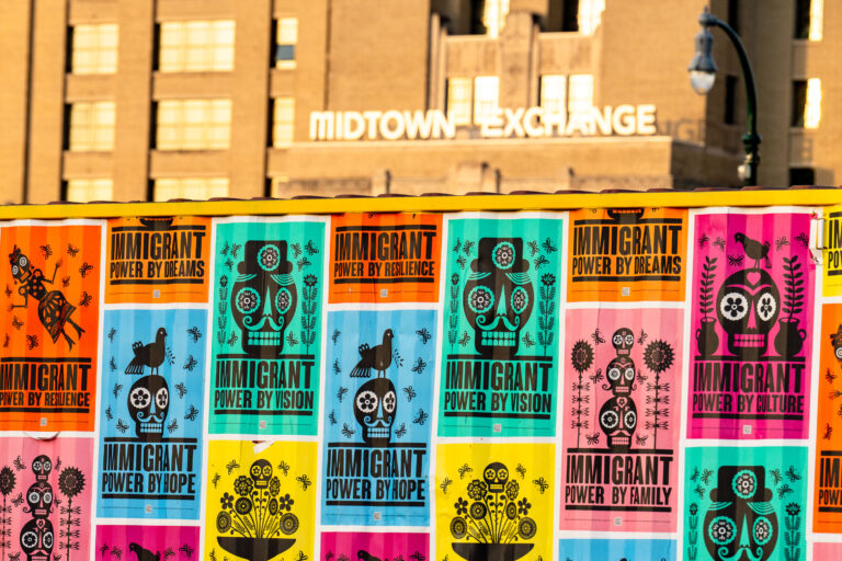 Immigrant Power By Vision art installation, Minneapolis 2 Posters on a shipping container near the Midtown Exchange