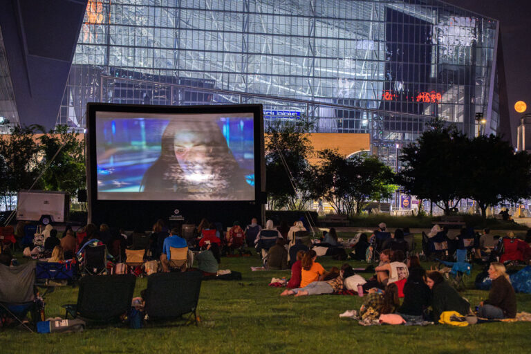 Downtown Minneapolis Movies In The park 3 Twilight playing at The Commons park in Downtown Minneapolis during a full moon.