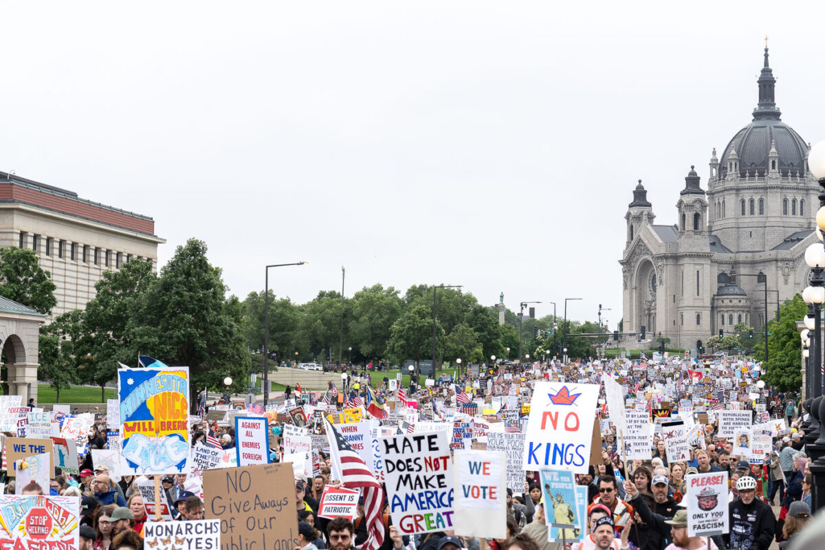 Despite warnings from the law enforcement not to attend today’s No Kings rally after this mornings shootings of Minnesota lawmakers with the killer on the lose, the No Kings Rally is happening at the Minnesota State Capitol in St. Paul.

Protesters march to the State Capitol.