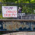 Protesters with banners during rush hour tonight over I-394. They read: Trump: Chaos +Cruelty, Rule Of Law, Due Process