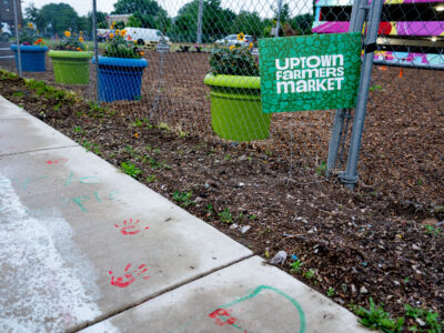 Uptown Farmers Market Sign with Protest Handprints, Uptown Minneapolis