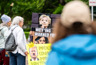 Protester holding up a sign reading "We Fing warned you"

Despite warnings from the law enforcement not to attend today’s No Kings rally after this mornings shootings of Minnesota lawmakers with the killer on the lose, the No Kings Rally is happening at the Minnesota State Capitol in St. Paul.