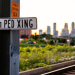 A 24th PED XING sign in South Minneapolis. The sign is on the Metro Transit light rail tracks near Downtown.