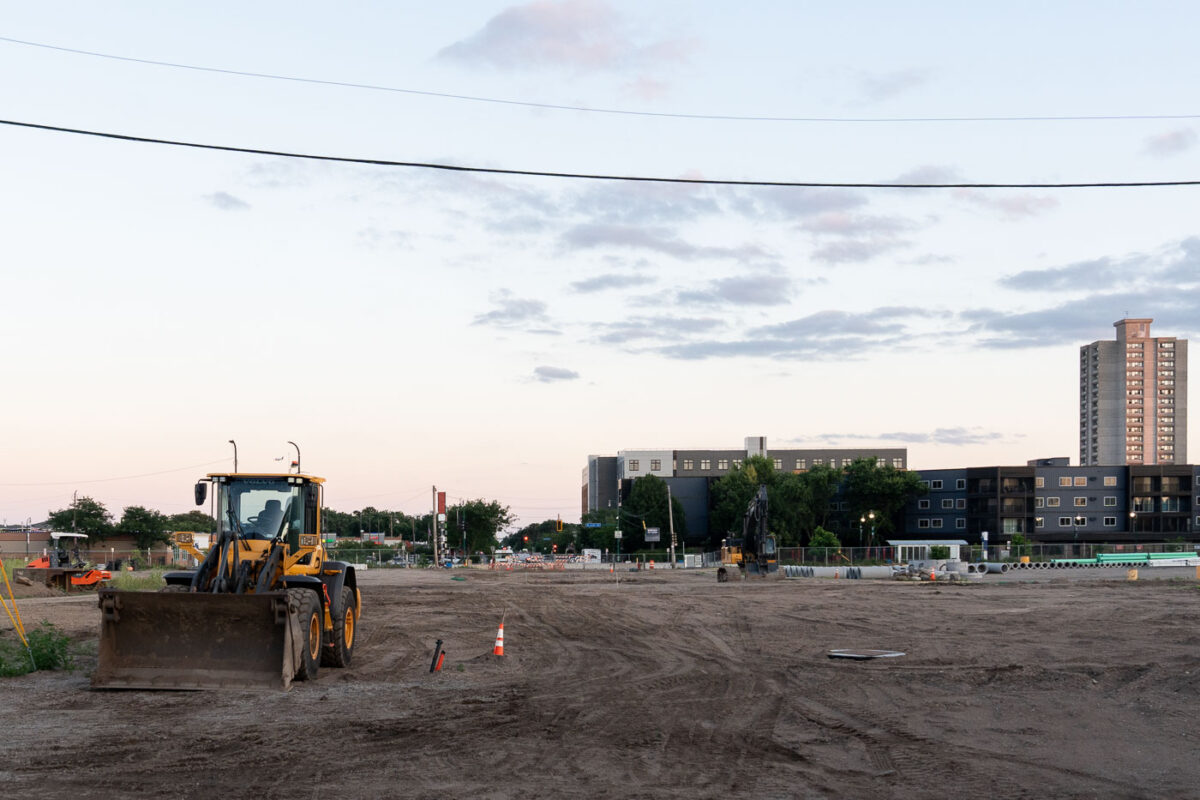 Dirt and work trucks on Nicollet Ave making a road