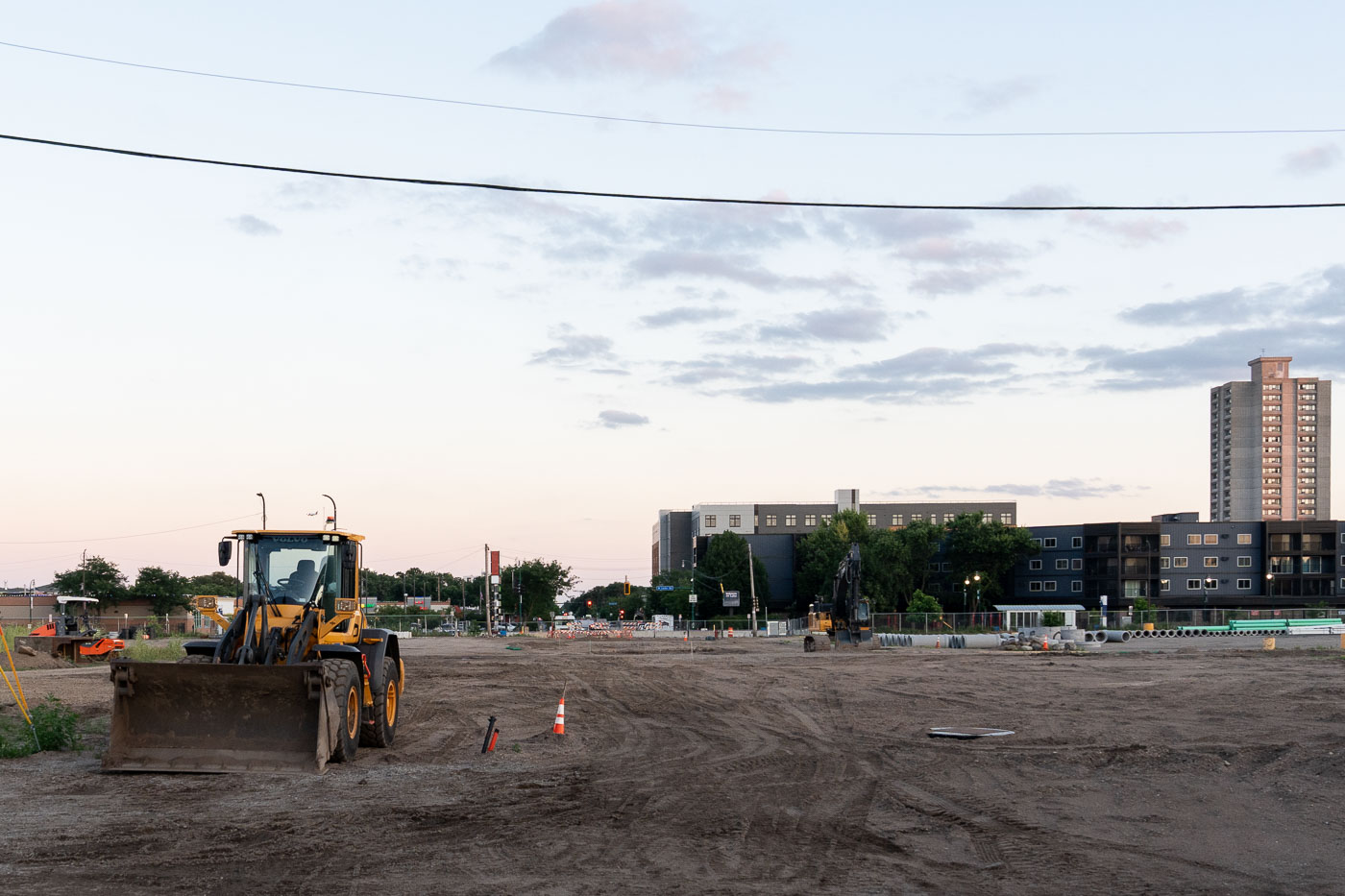 Dirt and work trucks on Nicollet Ave making a road