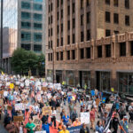 Protesters in Downtown Minneapolis as part of nationwide “Good trouble lives on” protests. Organizers say “Good Trouble Lives On is a national day of action to respond to the attacks on our civil and human rights by the Trump administration. Together, we’ll remind them that in America, the power lies with the people.” After gathering at the Hennepin County Government Center listening to speakers such as Toussaint Morrison, Nekima Levy Armstrong, and Lieutenant Governor Peggy Flanagan they marched through Downtown Minneapolis.